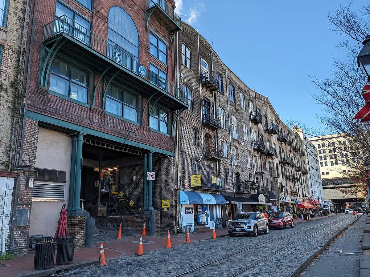 Historic buildings along River Street in Savannah, including the Cotton Exchange